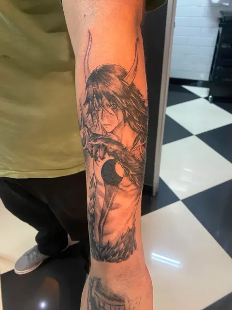 Anime character tattoo on the forearm, by Chad Solomon