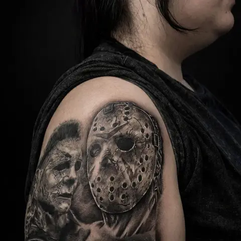 Horror film portrait collage tattoo on the upper arm and shoulder, by Chad Solomon