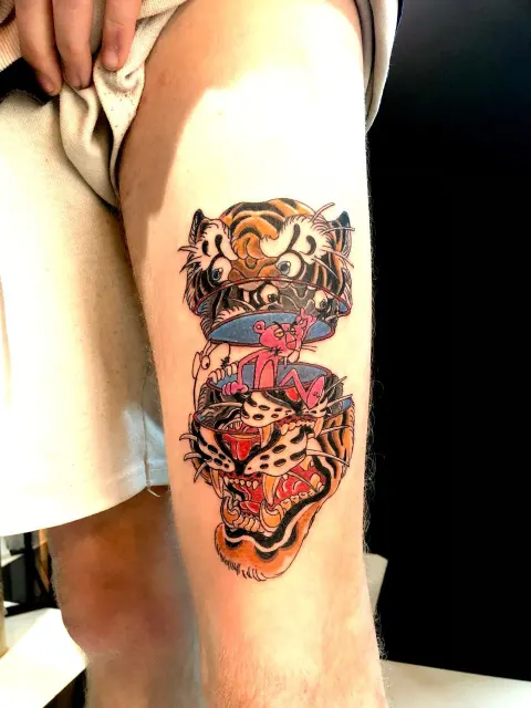 Neo-traditional tiger and diamond tattoo on the upper arm, by Chad Solomon
