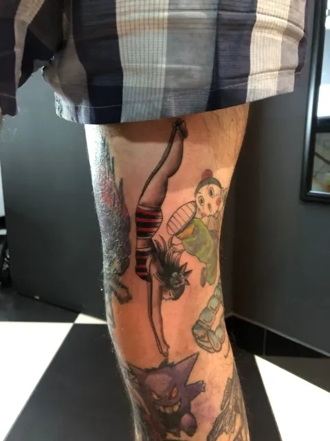 Patchwork leg with a pin-up diver, Astro Boy and Gengar, by Chad Solomon