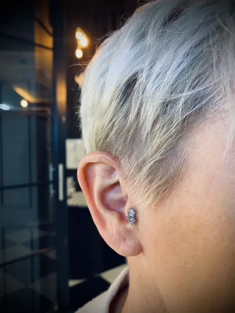 Conch piercing, by Chandre Louw