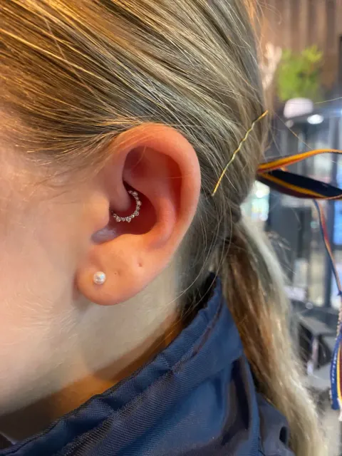 Jewelled daith clicker, by Chandre Louw