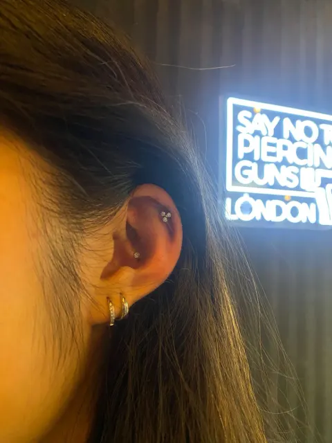 Flat and double lobe piercings, by Chandre Louw
