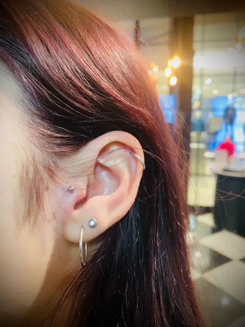Flat, helix and lobe hoop piercings, by Chandre Louw