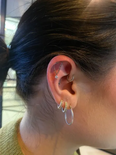 Chain from helix to daith with stacked lobe hoops, by Chandre Louw