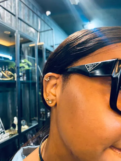 Helix and lobe piercings, by Chandre Louw