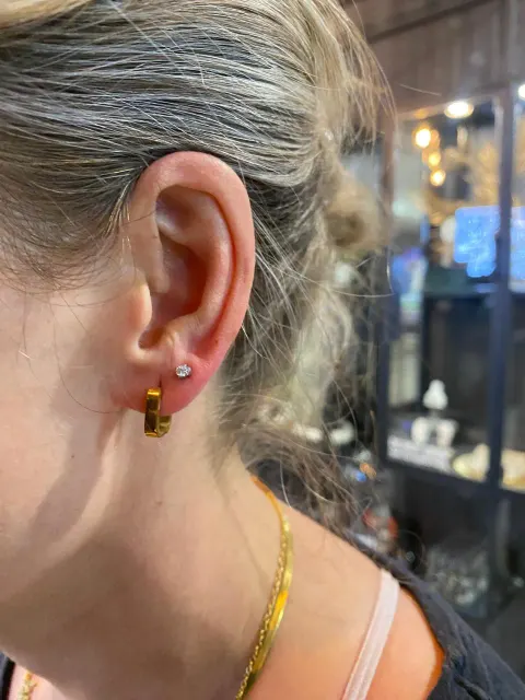 Lobe stud and huggie hoop, by Chandre Louw