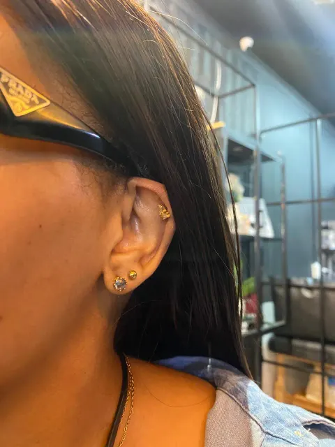 Tragus and stacked lobe piercings, by Chandre Louw