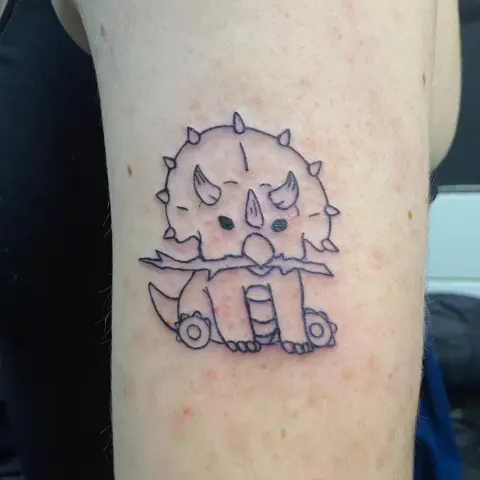Cartoon triceratops tattoo, by Kayla Grimwood