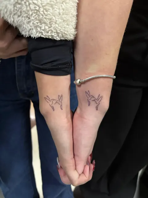 Matching rabbit tattoos tattoo on the wrists, by Kayla Grimwood