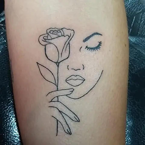 Rose and face line art tattoo, by Kayla Grimwood