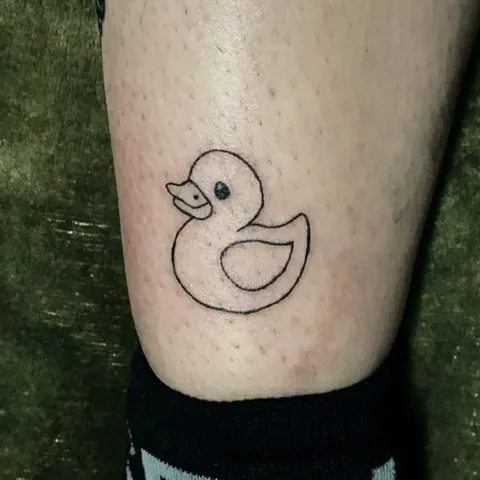 Rubber duck outline tattoo on the ankle, by Kayla Grimwood