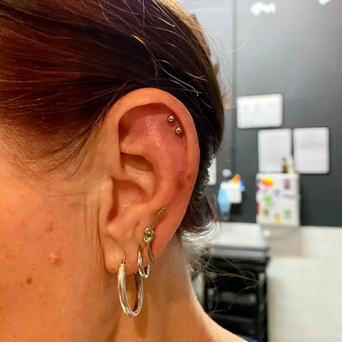 Double helix studs with stacked lobe hoops, by Kelsey Messiah