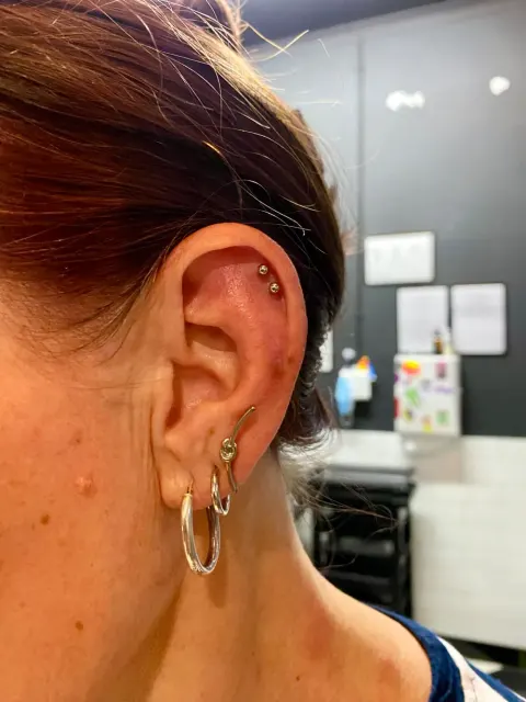 Double helix studs with stacked lobe hoops, by Kelsey Messiah
