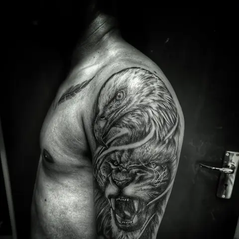 Lion and eagle tattoo on the shoulder and chest, by Rob Turner