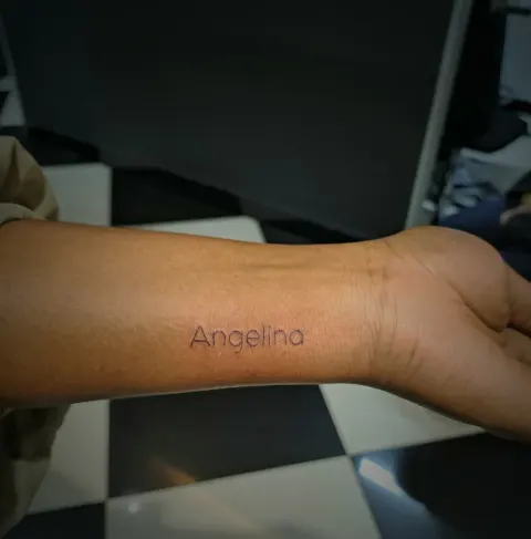 Fine name script on the inner wrist, by Tayla Symons