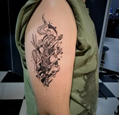 Geometric chef and kitchen composition tattoo on the upper arm, by Tayla Symons