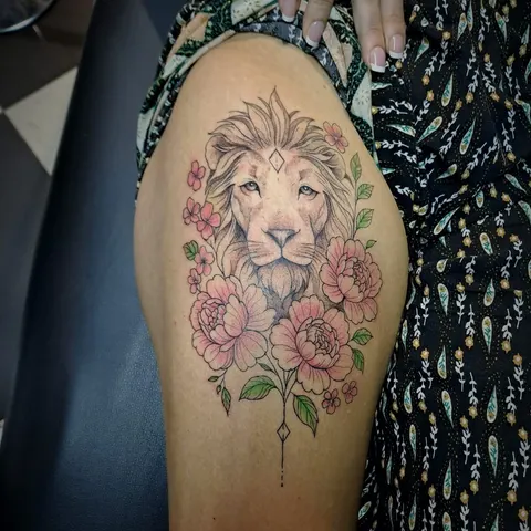 Lion with pink peonies and leaves, thigh tattoo, by Tayla Symons