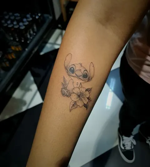 Stitch with flowers, fine line forearm tattoo, by Tayla Symons